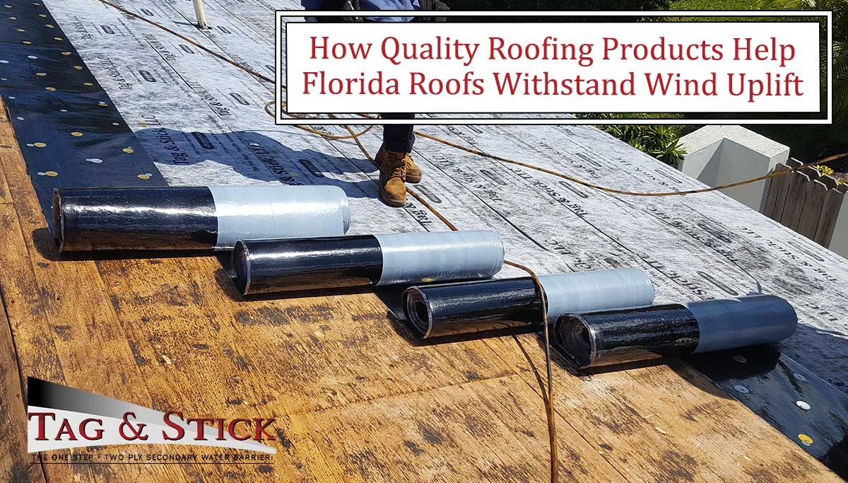 Roofers adding underlayment over a roof's foundation